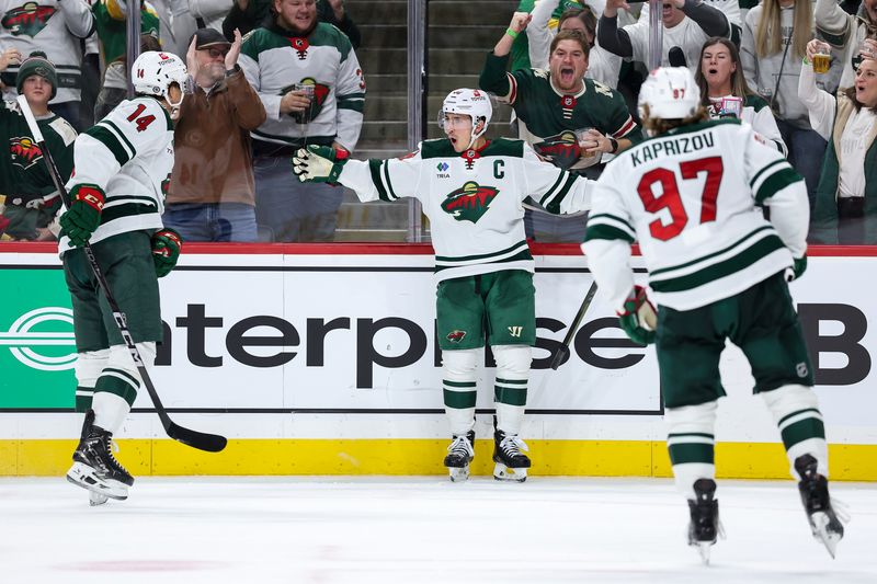 Nov 30, 2024; Saint Paul, Minnesota, USA; Minnesota Wild defenseman Jared Spurgeon (46) celebrates his game winning goal in overtime against the Nashville Predators at Xcel Energy Center. Mandatory Credit: Matt Krohn-Imagn Images