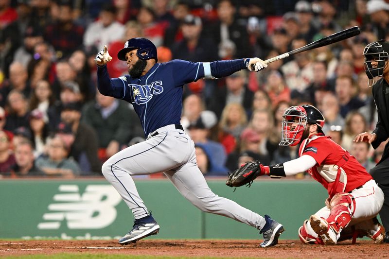 Sep 27, 2023; Boston, Massachusetts, USA; Tampa Bay Rays center fielder Manuel Margot (13) hits a RBI double against the Boston Red Sox during the fourth inning at Fenway Park. Mandatory Credit: Brian Fluharty-USA TODAY Sports