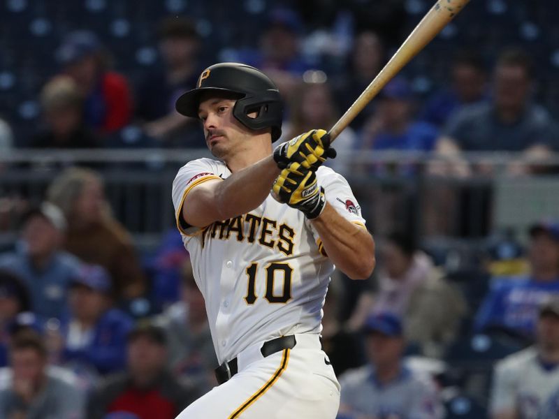 Apr 30, 2025; Pittsburgh, Pennsylvania, USA;  Pittsburgh Pirates right fielder Bryan Reynolds (10) hits a single against the Chicago Cubs during the fifth inning at PNC Park. Mandatory Credit: Charles LeClaire-Imagn Images