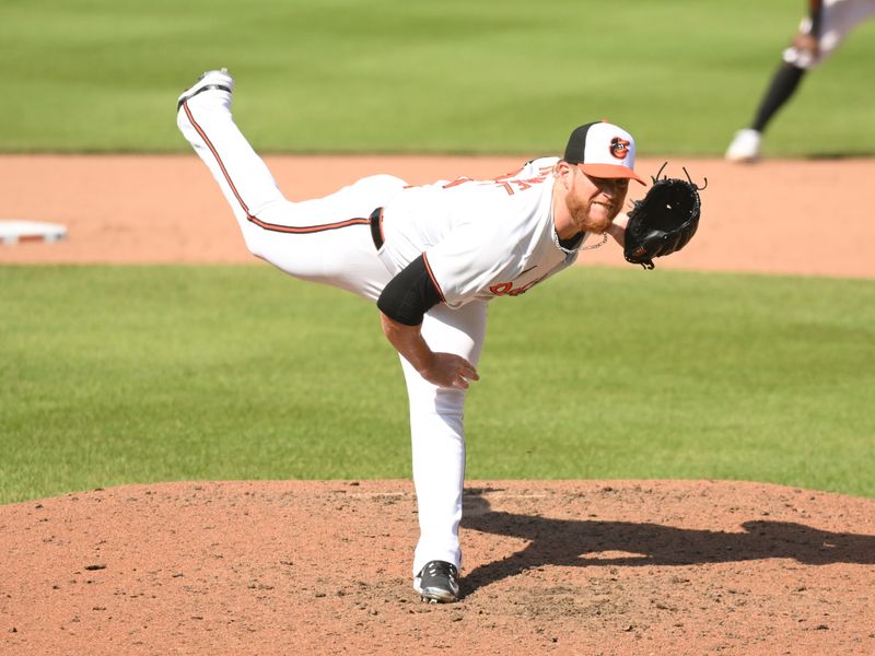 Apr 28, 2024; Baltimore, Maryland, USA;  Baltimore Orioles relief pitcher Craig Kimbrel (46) delivers a pitch during the ninth inning against the Oakland Athletics at Oriole Park at Camden Yards. Mandatory Credit: James A. Pittman-USA TODAY Sports