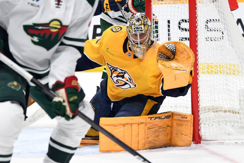 Feb 29, 2024; Nashville, Tennessee, USA; Nashville Predators goaltender Juuse Saros (74) watches the puck as it is played in the corner during the second period against the Minnesota Wild at Bridgestone Arena. Mandatory Credit: Christopher Hanewinckel-USA TODAY Sports