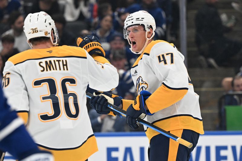 Oct 14, 2025; Toronto, Ontario, CAN;   Nashville Predators forward Michael McCarron (47) celebrates with forward Cole Smith (36) after scoring a goal against the Toronto Maple Leafs in the second period at Scotiabank Arena. Mandatory Credit: Dan Hamilton-Imagn Images