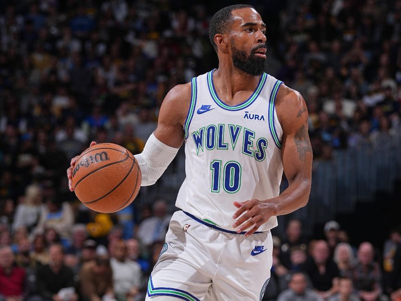 DENVER, CO - MARCH 29: Mike Conley #10 of the Minnesota Timberwolves dribbles the ball during the game against the Denver Nuggets on March 29, 2024 at the Ball Arena in Denver, Colorado. NOTE TO USER: User expressly acknowledges and agrees that, by downloading and/or using this Photograph, user is consenting to the terms and conditions of the Getty Images License Agreement. Mandatory Copyright Notice: Copyright 2024 NBAE (Photo by Bart Young/NBAE via Getty Images)