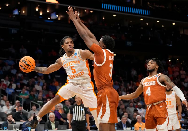 March 23, 2024, Charlotte, NC, USA; Tennessee Volunteers guard Zakai Zeigler (5) passes the ball away from Texas Longhorns guard Max Abmas (3) in the second round of the 2024 NCAA Tournament at the Spectrum Center. Mandatory Credit: Bob Donnan-USA TODAY Sports