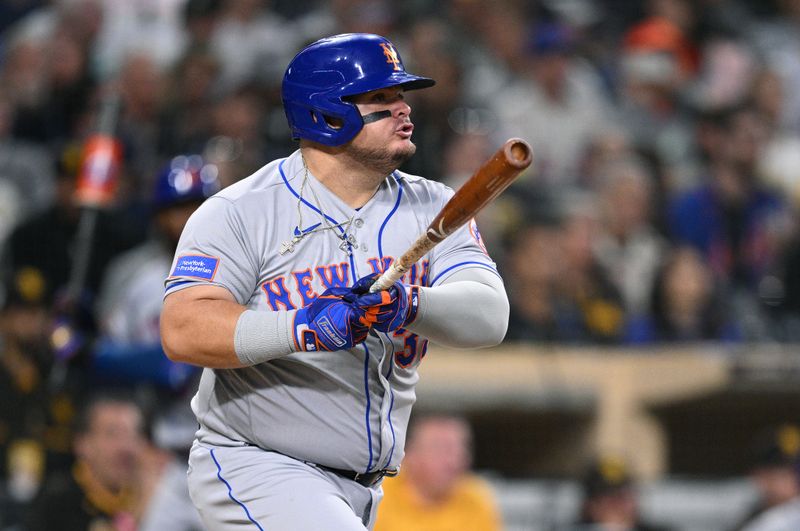 Jul 7, 2023; San Diego, California, USA; New York Mets designated hitter Daniel Vogelbach (32) hits an RBI single against the San Diego Padres during the fifth inning at Petco Park. Mandatory Credit: Orlando Ramirez-USA TODAY Sports