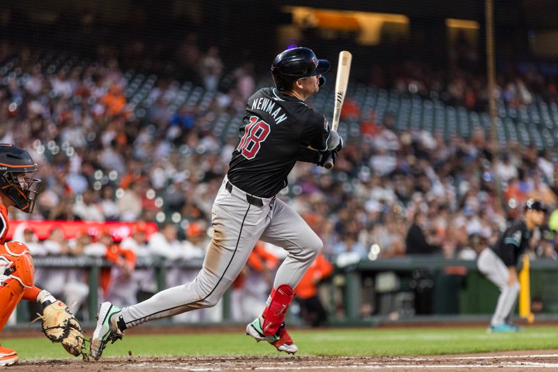 Sep 3, 2024; San Francisco, California, USA;  Arizona Diamondbacks second baseman Kevin Newman (18) hits a two-run single against the San Francisco Giants during the third inning at Oracle Park. Mandatory Credit: John Hefti-Imagn Images