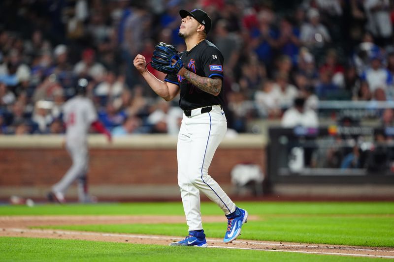 Jul 25, 2024; New York City, New York, USA; New York Mets pitcher Jose Butto (70) reacts to getting the third out against the Atlanta Braves during the sixth inning at Citi Field. Mandatory Credit: Gregory Fisher-USA TODAY Sports