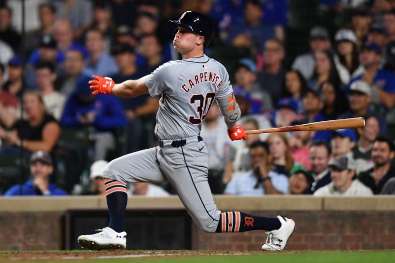 Aug 21, 2024; Chicago, Illinois, USA; Detroit Tigers right fielder Kerry Carpenter (30) hits a three-run home run during the ninth inning against the Chicago Cubs at Wrigley Field. Mandatory Credit: Patrick Gorski-USA TODAY Sports