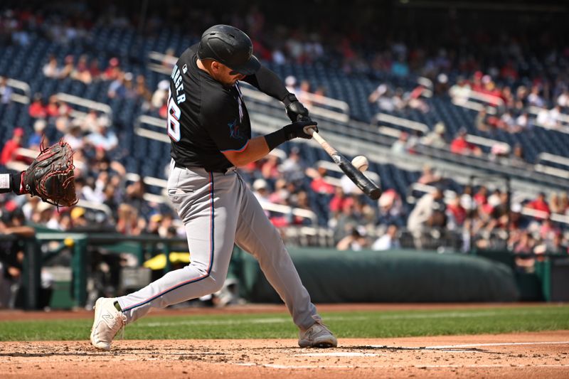 Sep 15, 2024; Washington, District of Columbia, USA; Miami Marlins third baseman Jake Burger (36) hits the ball into play against the Washington Nationals during the third inning at Nationals Park. Mandatory Credit: Rafael Suanes-Imagn Images