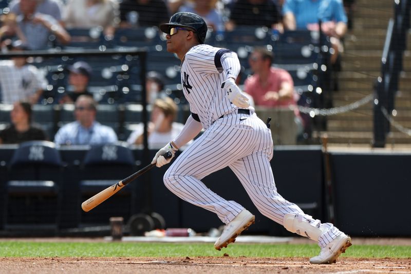 Mar 3, 2024; Tampa, Florida, USA;  New York Yankees left fielder Juan Soto (22) hits a solo home run against the Detroit Tigers in the first inning at George M. Steinbrenner Field. Mandatory Credit: Nathan Ray Seebeck-USA TODAY Sports