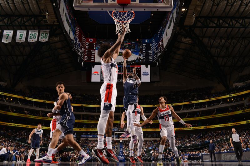 DALLAS, TX - FEBRUARY 12: Kyrie Irving #11 of the Dallas Mavericks drives to the basket during the game against the Washington Wizards on February 12, 2024 at the American Airlines Center in Dallas, Texas. NOTE TO USER: User expressly acknowledges and agrees that, by downloading and or using this photograph, User is consenting to the terms and conditions of the Getty Images License Agreement. Mandatory Copyright Notice: Copyright 2024 NBAE (Photo by Glenn James/NBAE via Getty Images)