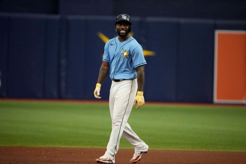 Apr 2, 2023; St. Petersburg, Florida, USA; Tampa Bay Rays left fielder Randy Arozarena (56) smiles at second base during the sixth inning at Tropicana Field. Mandatory Credit: Dave Nelson-USA TODAY Sports