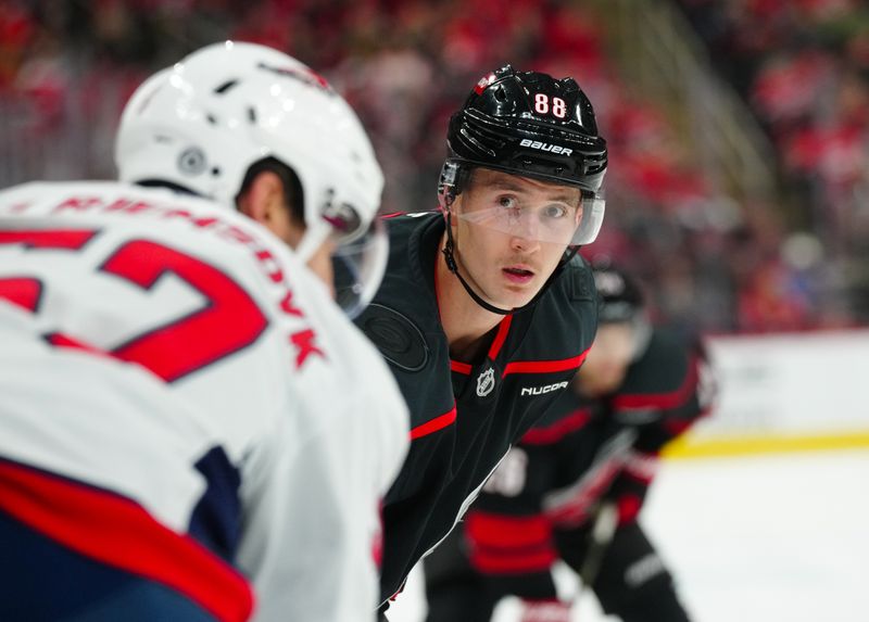 Nov 3, 2024; Raleigh, North Carolina, USA;  Carolina Hurricanes center Martin Necas (88) looks on against the Washington Capitals during the first period at Lenovo Center. Mandatory Credit: James Guillory-Imagn Images