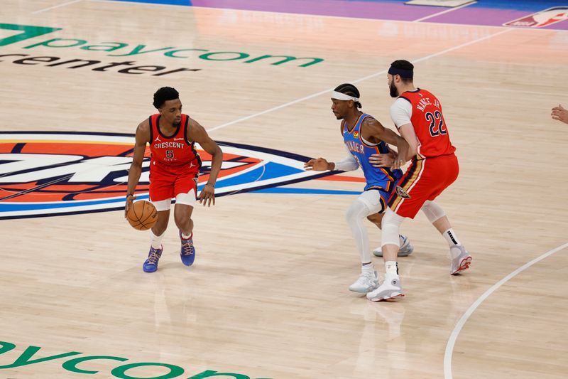 OKLAHOMA CITY, OK - APRIL 24: Herb Jones #5 of the New Orleans Pelicans dribbles the ball during the game against the Oklahoma City Thunder during Round 1 Game 2 of the 2024 NBA Playoffs on April 24, 2024 at Paycom Arena in Oklahoma City, Oklahoma. NOTE TO USER: User expressly acknowledges and agrees that, by downloading and or using this photograph, User is consenting to the terms and conditions of the Getty Images License Agreement. Mandatory Copyright Notice: Copyright 2024 NBAE (Photo by Martin McGrew/NBAE via Getty Images)