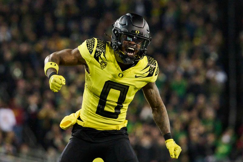 Nov 11, 2023; Eugene, Oregon, USA; Oregon Ducks defensive back Tysheem Johnson (0) celebrates during the second half after tackling a USC Trojans player for a loss in yardage at Autzen Stadium. Mandatory Credit: Troy Wayrynen-USA TODAY Sports