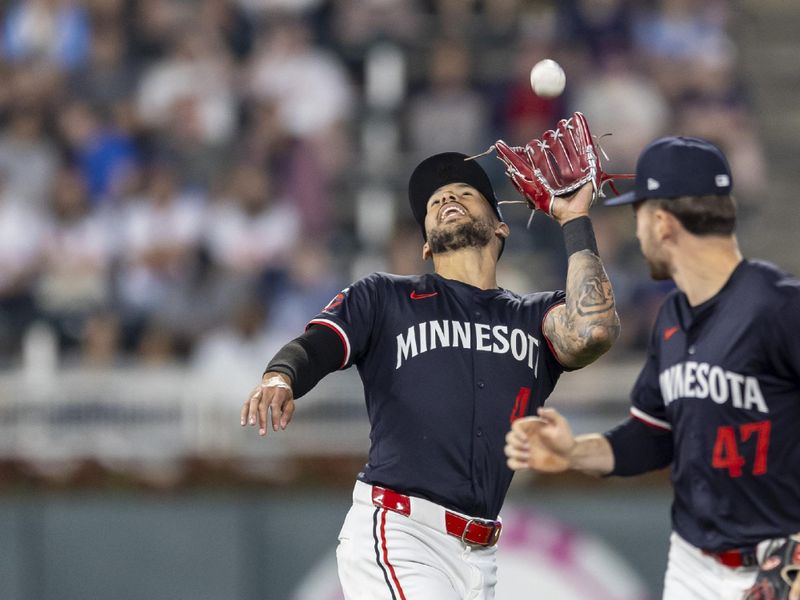 May 14, 2024; Minneapolis, Minnesota, USA; Minnesota Twins shortstop Carlos Correa (4) catches a fly ball against the New York Yankees in the ninth inning at Target Field. Mandatory Credit: Jesse Johnson-USA TODAY Sports