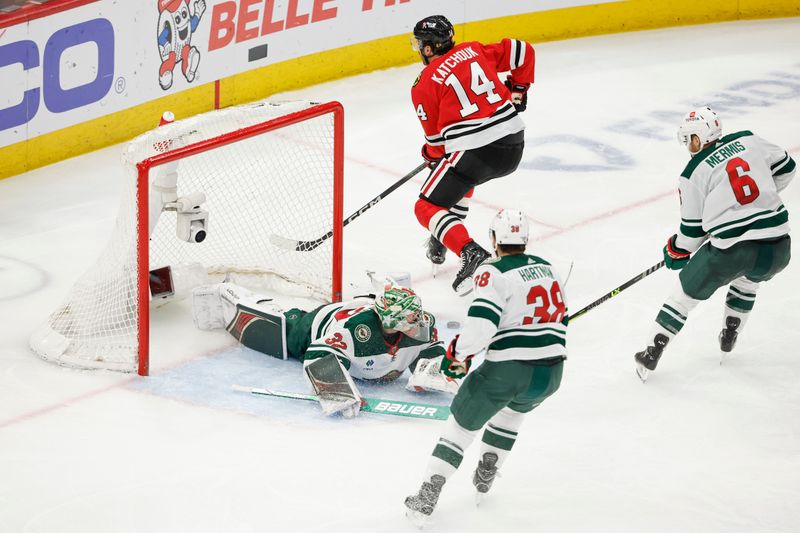 Feb 7, 2024; Chicago, Illinois, USA; Minnesota Wild goaltender Filip Gustavsson (32) defends a shot by Chicago Blackhawks left wing Boris Katchouk (14) during the third period at United Center. Mandatory Credit: Kamil Krzaczynski-USA TODAY Sports