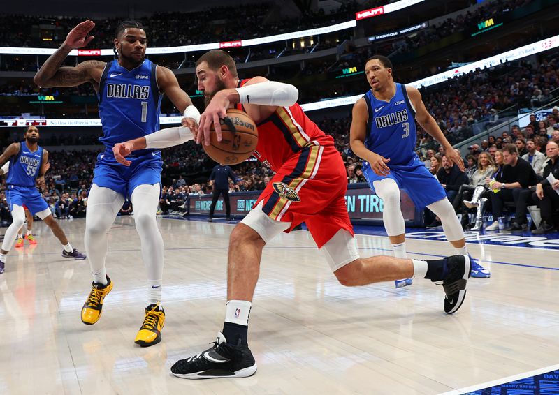 DALLAS, TEXAS - JANUARY 13: Jonas Valanciunas #17 of the New Orleans Pelicans tries to get past Jaden Hardy #1 and Grant Williams #3 of the Dallas Mavericks in the second half of an NBA basketball game at American Airlines Center on January 13, 2024 in Dallas, Texas. NOTE TO USER: User expressly acknowledges and agrees that, by downloading and or using this photograph, User is consenting to the terms and conditions of the Getty Images License Agreement. (Photo by Richard Rodriguez/Getty Images)