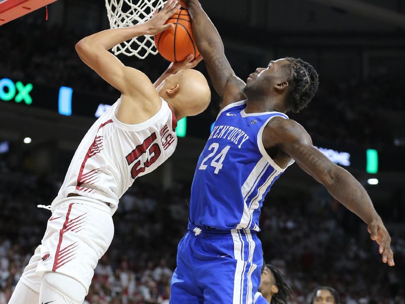 Mar 4, 2023; Fayetteville, Arkansas, USA; Kentucky Wildcats forward Chris Livingston (24) blocks a shot attempt by Arkansas Razorbacks guard Jordan Walsh (13) during the second half at Bud Walton Arena. Kentucky won 88-79. Mandatory Credit: Nelson Chenault-USA TODAY Sports