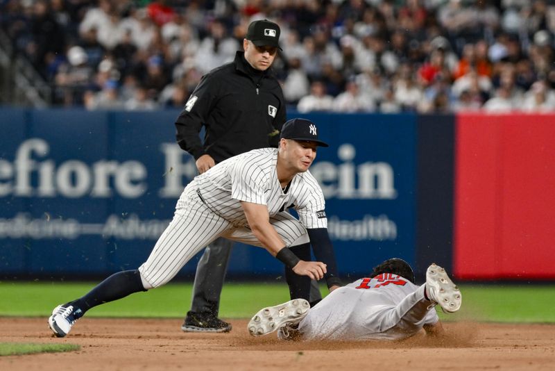 Jun 8, 2025; Bronx, New York, USA; New York Yankees shortstop Anthony Volpe (11) tags out Boston Red Sox second baseman David Hamilton (17) on a steal attempt during the eighth inning at Yankee Stadium. Mandatory Credit: John Jones-Imagn Images