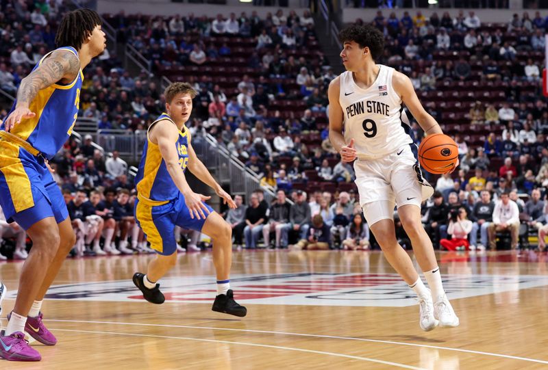 Dec 21, 2025; Hershey, Pennsylvania, USA; Penn State Nittany Lions guard Melih Tunca (9) dribbles the ball during the first half against the Pittsburg Panthers at Giant Center. Mandatory Credit: Matthew O'Haren-Imagn Images
