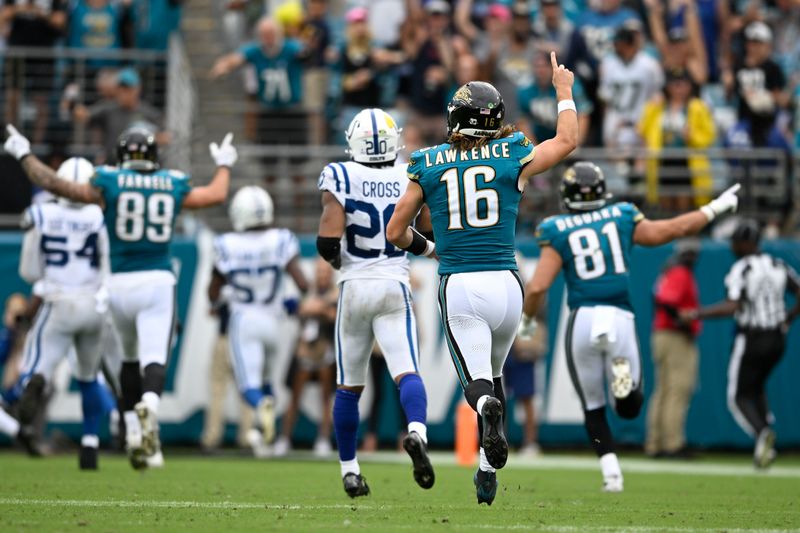 Jacksonville Jaguars quarterback Trevor Lawrence (16) reacts after a touchdown during the second half of an NFL football game against the Indianapolis Colts, Sunday, Oct. 6, 2024, in Jacksonville, Fla. (AP Photo/Phelan M. Ebenhack)