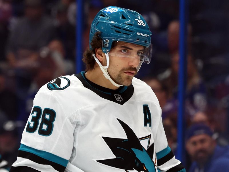 Dec 5, 2024; Tampa, Florida, USA; San Jose Sharks defenseman Mario Ferraro (38) looks on against the Tampa Bay Lightning during the first period at Amalie Arena. Mandatory Credit: Kim Klement Neitzel-Imagn Images