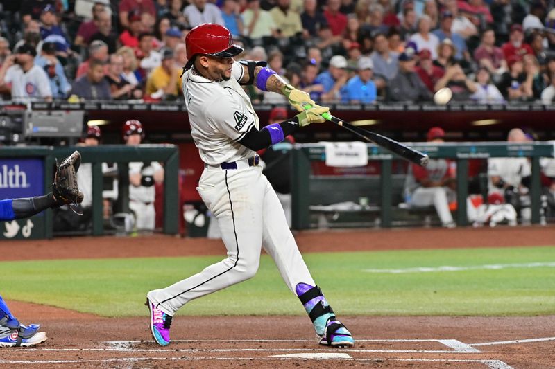 Apr 17, 2024; Phoenix, Arizona, USA;  Arizona Diamondbacks second baseman Ketel Marte (4) hits a solo home run on the first pitch in the bottom on the first inning against the Chicago Cubs at Chase Field. Mandatory Credit: Matt Kartozian-USA TODAY Sports