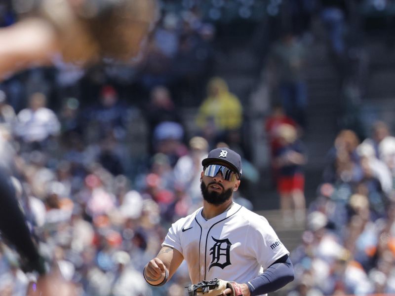May 25, 2025; Detroit, Michigan, USA;  Detroit Tigers second base Gleyber Torres (25) makes a throw to first to complete a double play in the fifth inning against the Cleveland Guardians at Comerica Park. Mandatory Credit: Rick Osentoski-Imagn Images