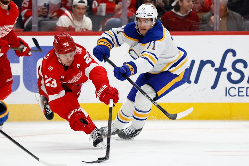 Nov 15, 2025; Detroit, Michigan, USA; Detroit Red Wings left wing Lucas Raymond (23) and Buffalo Sabres center Ryan McLeod (71) battle for the puck in the second period at Little Caesars Arena. Mandatory Credit: Rick Osentoski-Imagn Images Nov 15, 2025; Detroit, Michigan, USA; Detroit Red Wings left wing Lucas Raymond (23) and Buffalo Sabres center Ryan McLeod (71) battle for the puck in the second period at Little Caesars Arena. Mandatory Credit: Rick Osentoski-Imagn Images