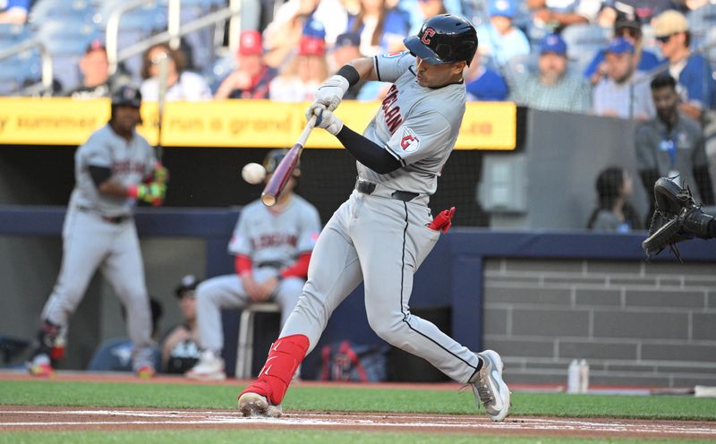 Jun 14, 2024; Toronto, Ontario, CAN;  Cleveland Guardians left fielder Steven Kwan (38) hits a double against the Toronto Blue Jays in the first inning at Rogers Centre. Mandatory Credit: Dan Hamilton-USA TODAY Sports