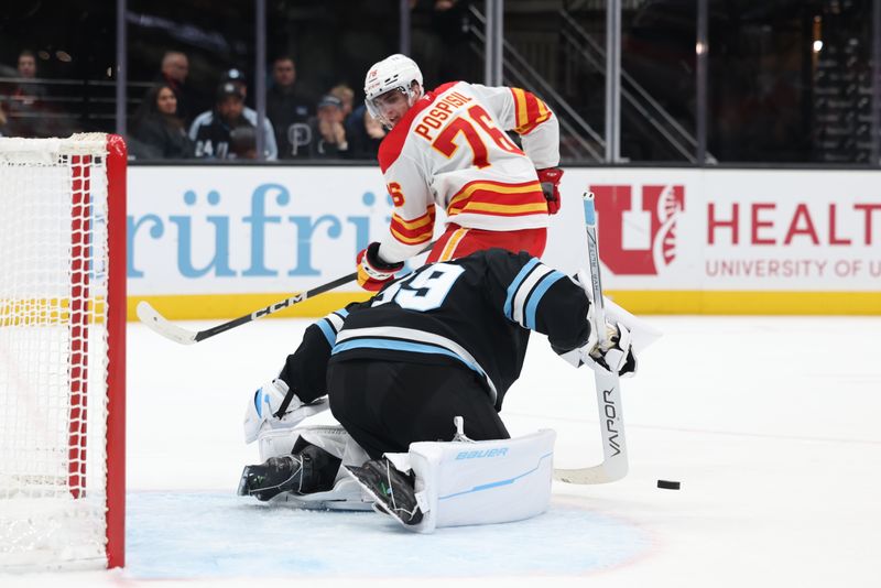 Oct 30, 2024; Salt Lake City, Utah, USA; Calgary Flames center Martin Pospisil (76) has a shot blocked by Utah Hockey Club goaltender Connor Ingram (39) during the first period at Delta Center. Mandatory Credit: Rob Gray-Imagn Images