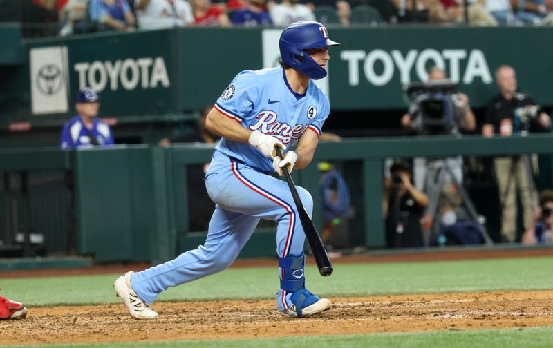 Jun 1, 2025; Arlington, Texas, USA; Texas Rangers first baseman Josh Smith (8) hits a two-run home run during the eighth inning against the St. Louis Cardinals at Globe Life Field. Mandatory Credit: Kevin Jairaj-Imagn Images