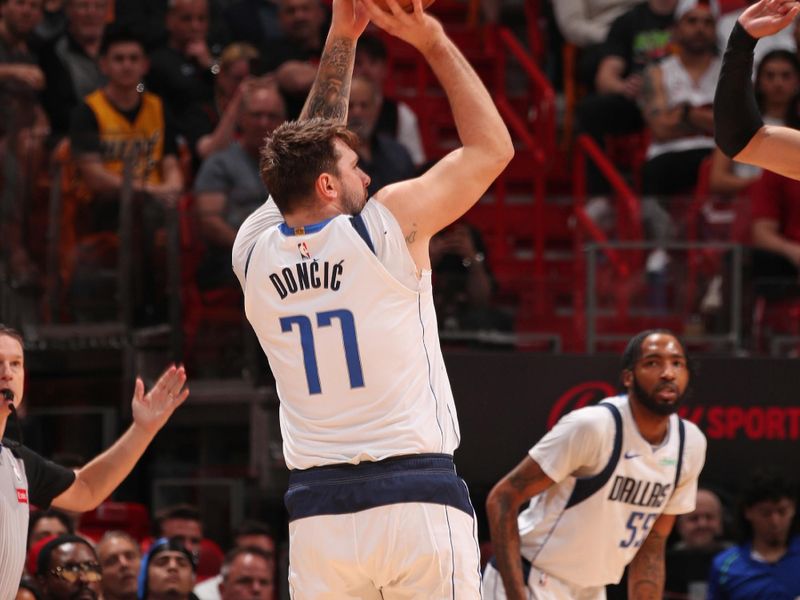 MIAMI, FL - APRIL 10:  Luka Doncic #77 of the Dallas Mavericks shoots the ball during the game against the Miami Heat on April 10, 2024 at Kaseya Center in Miami, Florida. NOTE TO USER: User expressly acknowledges and agrees that, by downloading and or using this Photograph, user is consenting to the terms and conditions of the Getty Images License Agreement. Mandatory Copyright Notice: Copyright 2024 NBAE (Photo by Issac Baldizon/NBAE via Getty Images)