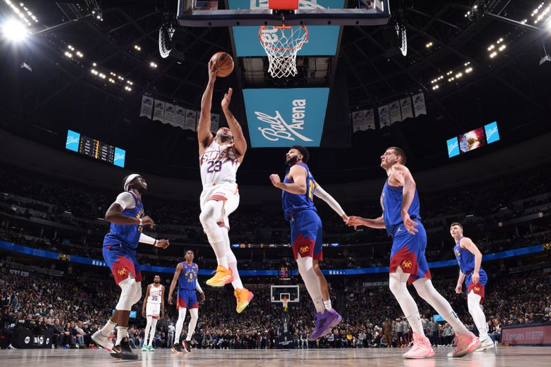 DENVER, CO - MARCH 5: Eric Gordon #23 of the Phoenix Suns drives to the basket during the game against the Denver Nuggets on March 5, 2024 at the Ball Arena in Denver, Colorado. NOTE TO USER: User expressly acknowledges and agrees that, by downloading and/or using this Photograph, user is consenting to the terms and conditions of the Getty Images License Agreement. Mandatory Copyright Notice: Copyright 2024 NBAE (Photo by Garrett Ellwood/NBAE via Getty Images)