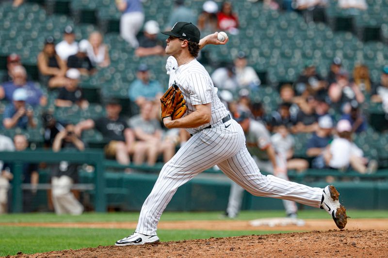Jun 29, 2025; Chicago, Illinois, USA; Chicago White Sox relief pitcher Mike Vasil (61) delivers a pitch against the San Francisco Giants during the ninth inning at Rate Field. Mandatory Credit: Kamil Krzaczynski-Imagn Images