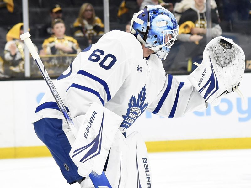 Apr 30, 2024; Boston, Massachusetts, USA; Toronto Maple Leafs goaltender Joseph Woll (60) makes a glove save during warmups prior to game five of the first round of the 2024 Stanley Cup Playoffs against the Boston Bruins at TD Garden. Mandatory Credit: Bob DeChiara-USA TODAY Sports