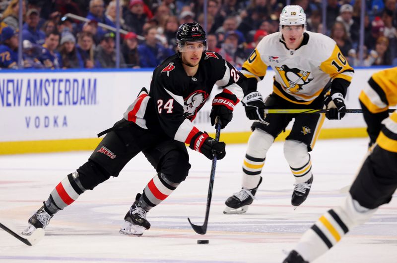 Jan 17, 2025; Buffalo, New York, USA;  Buffalo Sabres center Dylan Cozens (24) skates up ice with the puck during the second period against the Pittsburgh Penguins at KeyBank Center. Mandatory Credit: Timothy T. Ludwig-Imagn Images