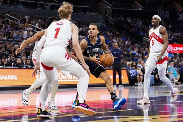 ORLANDO, FLORIDA - NOVEMBER 21: Cole Anthony #50 of the Orlando Magic drives to the basket against the Toronto Raptors during the first half of an NBA In-Season Tournament game at Amway Center on November 21, 2023 in Orlando, Florida. NOTE TO USER: User expressly acknowledges and agrees that, by downloading and or using this photograph, User is consenting to the terms and conditions of the Getty Images License Agreement. (Photo by Rich Storry/Getty Images)