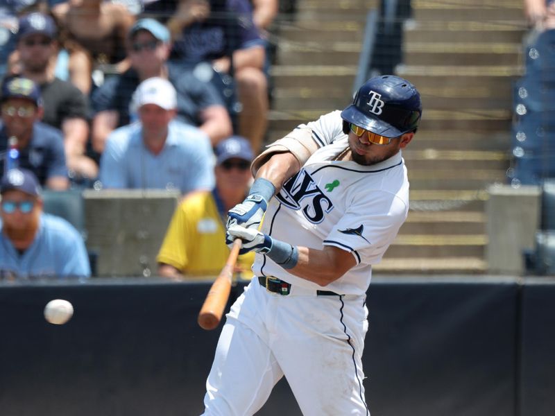 May 28, 2025; Tampa, FL, USA;  Tampa Bay Rays first base Jonathan Aranda (62) hits an RBI single during the fifth inning against the Minnesota Twins at George M. Steinbrenner Field. Mandatory Credit: Kim Klement Neitzel-Imagn Images