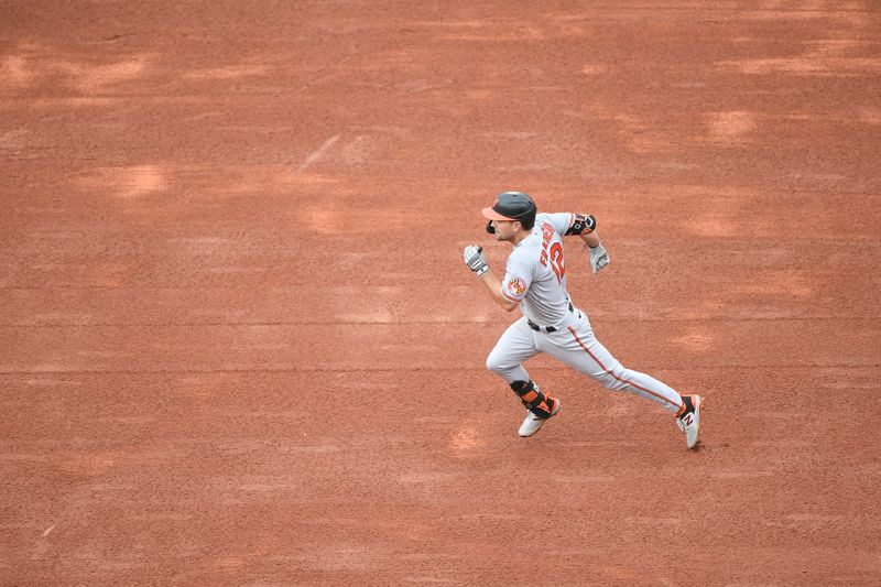 Sep 10, 2023; Boston, Massachusetts, USA;  Baltimore Orioles second baseman Adam Frazier (12) runs for second base during the second inning against the Boston Red Sox at Fenway Park. Mandatory Credit: Bob DeChiara-USA TODAY Sports