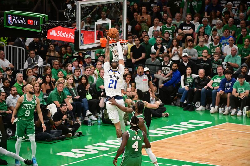 BOSTON, MA - JUNE 17: Daniel Gafford #21 of the Dallas Mavericks dunks the ball during the game against the Boston Celtics during Game Five of the 2024 NBA Finals on June 17, 2024 at the TD Garden in Boston, Massachusetts. NOTE TO USER: User expressly acknowledges and agrees that, by downloading and or using this photograph, User is consenting to the terms and conditions of the Getty Images License Agreement. Mandatory Copyright Notice: Copyright 2024 NBAE  (Photo by Adam Hagy/NBAE via Getty Images)