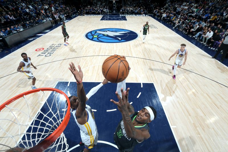 MINNEAPOLIS, MN -  MARCH 24: Jaden McDaniels #3 of the Minnesota Timberwolves drives to the basket during the game against the Golden State Warriors on March 24, 2024 at Target Center in Minneapolis, Minnesota. NOTE TO USER: User expressly acknowledges and agrees that, by downloading and or using this Photograph, user is consenting to the terms and conditions of the Getty Images License Agreement. Mandatory Copyright Notice: Copyright 2024 NBAE (Photo by David Sherman/NBAE via Getty Images)