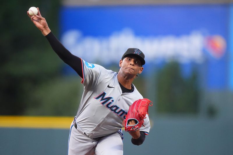 Aug 26, 2024; Denver, Colorado, USA; Miami Marlins starting pitcher Edward Cabrera (27) delivers a pitch in the first inning against the Colorado Rockies at Coors Field. Mandatory Credit: Ron Chenoy-USA TODAY Sports