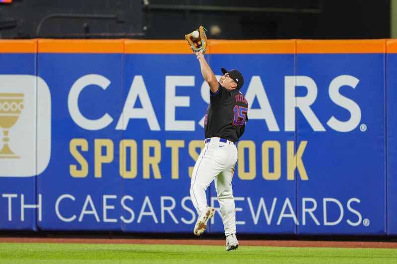 Jul 10, 2024; New York City, New York, USA; New York Mets center fielder Tyrone Taylor (15) catches a fly ball hit by Washington Nationals catcher Keibert Ruiz (not pictured) during the eighth inning at Citi Field. Mandatory Credit: Gregory Fisher-USA TODAY Sports