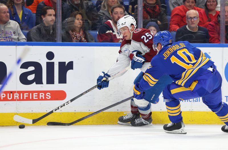 Dec 3, 2024; Buffalo, New York, USA;  Colorado Avalanche right wing Logan O'Connor (25) looks to make a pass as Buffalo Sabres defenseman Henri Jokiharju (10) defends during the first period at KeyBank Center. Mandatory Credit: Timothy T. Ludwig-Imagn Images