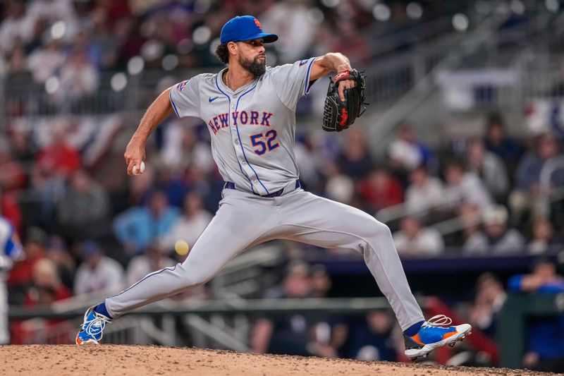 Apr 8, 2024; Cumberland, Georgia, USA; New York Mets relief pitcher Jorge Lopez (52) pitches against the Atlanta Braves during the ninth inning at Truist Park. Mandatory Credit: Dale Zanine-USA TODAY Sports