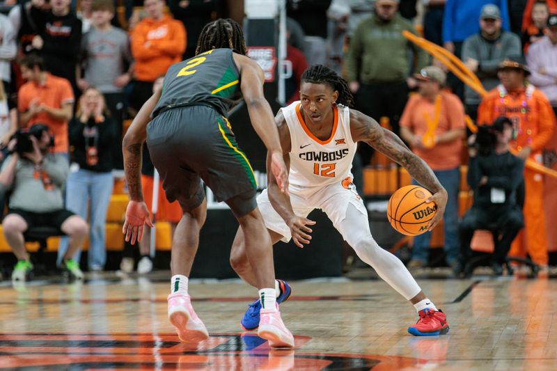 Jan 6, 2024; Stillwater, Oklahoma, USA;  Oklahoma State Cowboys guard Javon Small (12) looks to get around Baylor Bears guard Jayden Nunn (2) during the first half at Gallagher-Iba Arena. Mandatory Credit: William Purnell-USA TODAY Sports