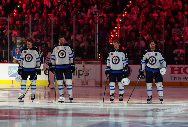 Apr 28, 2024; Denver, Colorado, USA; Members of the Winnipeg Jets before the start of the game against the Colorado Avalanche of game four of the first round of the 2024 Stanley Cup Playoffs at Ball Arena. Mandatory Credit: Ron Chenoy-USA TODAY Sports