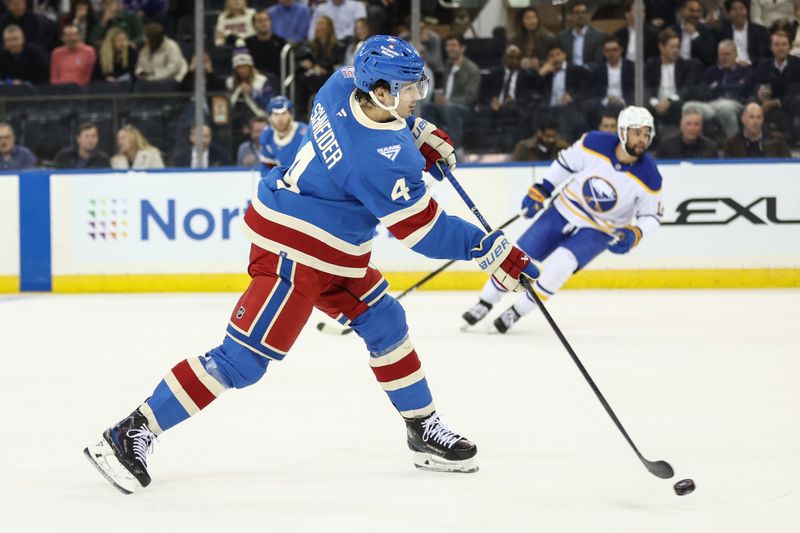 Jan 8, 2026; New York, New York, USA;  New York Rangers defenseman Braden Schneider (4) attempts a shot on goal in the first period against the Buffalo Sabres at Madison Square Garden. Mandatory Credit: Wendell Cruz-Imagn Images